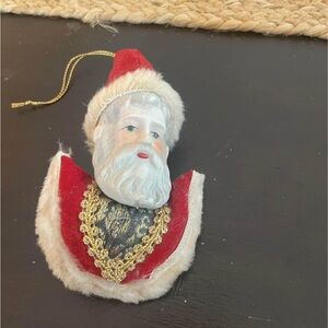 Festive Red and White Holiday Ornament with Gold Accents